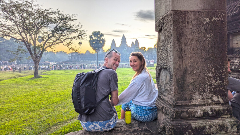 Relaxing on the northern library of Angkor Wat temple at Sunrise.