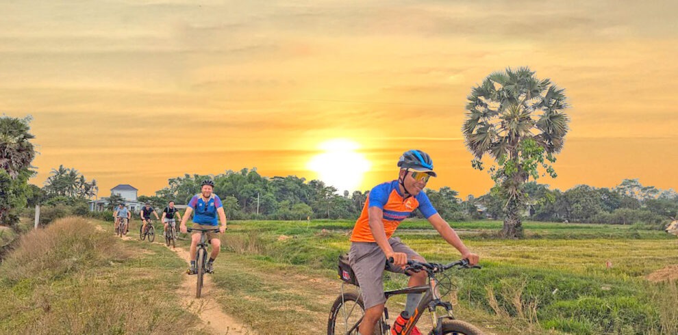 Siem Reap Twilight Bike Tour with locals and sunset drink over the rice field