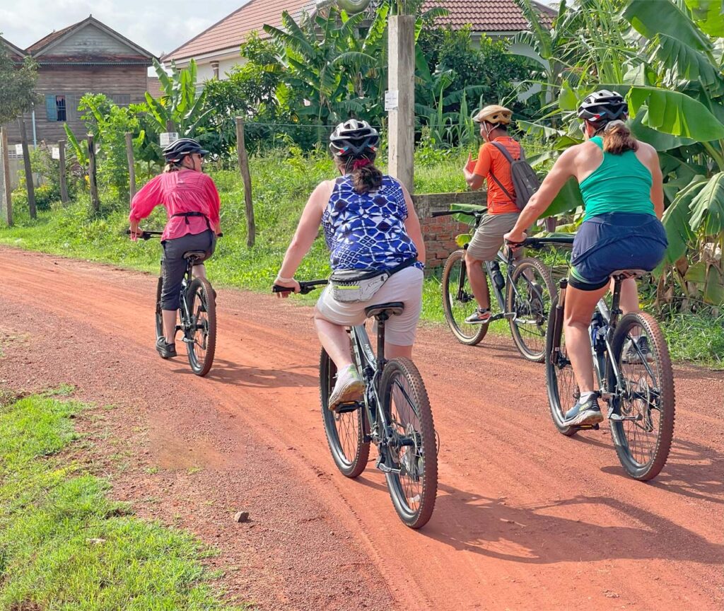 Cycling on back road in the village of Siem Reap