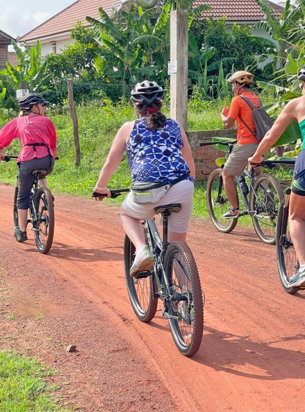 Cycling on back road in the village of Siem Reap