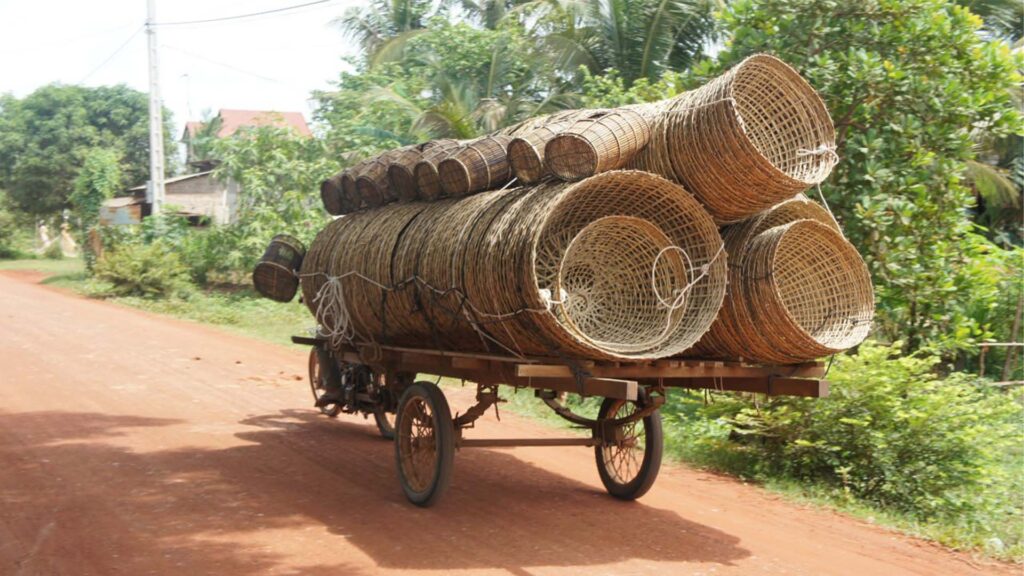 An amazing transportation in Cambodia, a trailer carry all the rattan buckets