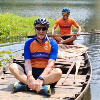 Riding the boat on the Angkor Thom moat with local guide and cycling
